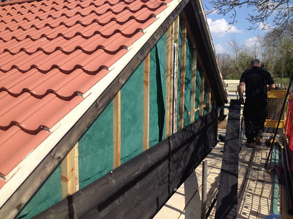 External cladding of the shop commences.